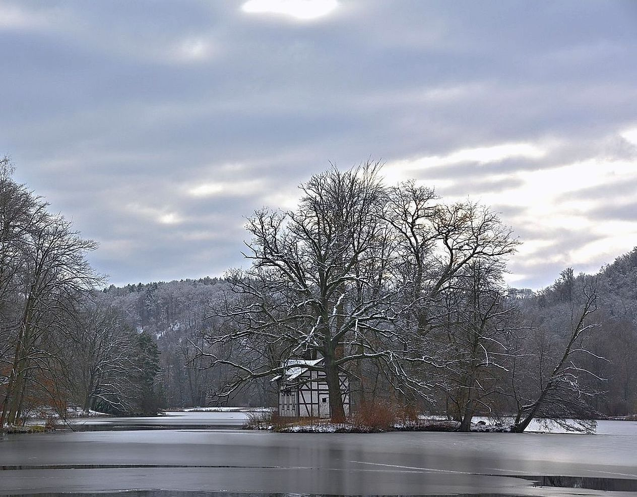 Two guides reading a paper map on a hillside